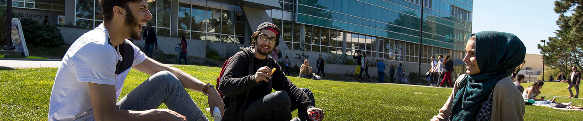 Students relaxing on the qued